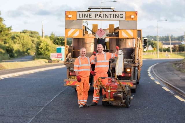 Busy painting lines on the night shift in Carndonagh is Kenny Johnson and Aaron O'Kane from White Mountain contractors (Picture by Brendan Diver)
