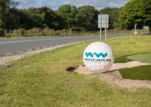Tee time.... Giant Golf Ball installations have been installed at key locations across the peninsula, including this one in the Greencastle area. (Picture by Brendan Diver)