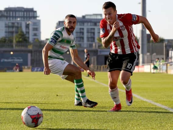 Derry City debutante, Ben Fisk skips past Rovers defender, Roberto Lopes during the first half of Friday night's match at Tallaght Stadium.