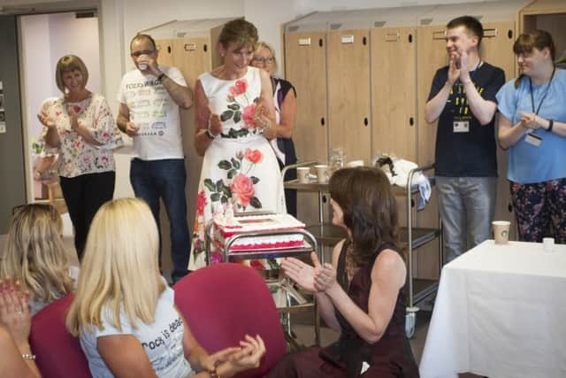 ANOTHER SURPISE!. . . Mrs. Lindsay is overwhelmed when a birthday cake to celebrate her 60th is wheeled into the room during FridayÃ¢Â¬"s function at St. MaryÃ¢Â¬"s College.