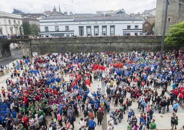 The crowd making their way into Guildhall Square for the official opening ceremony of the 2018 O'Neills Foyle Cup parade.