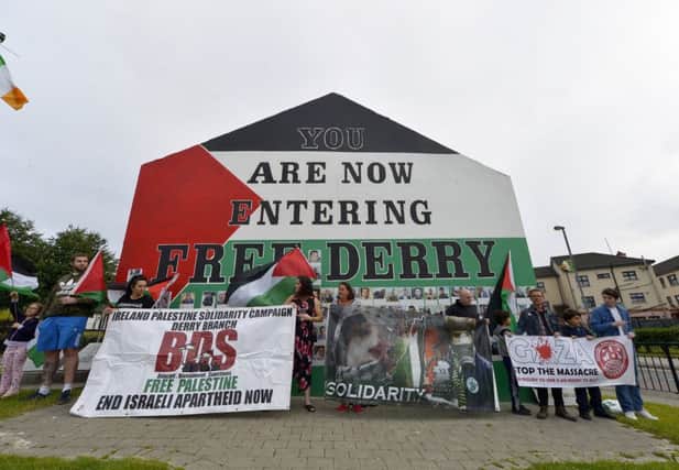Some of the attendance at a rally at Free Derry Corner, on Tuesday evening last, organised by the Ireland-Palestine Solidarity campaign. DER2918GS039
