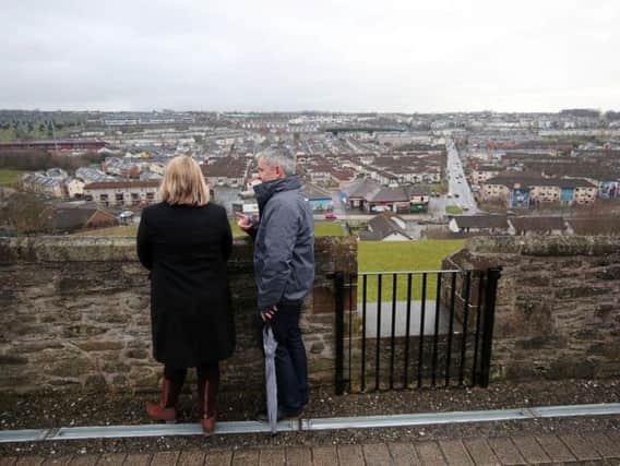 Karen Bradley overlooking the Bogside during a visit to the city earlier this year from almost the exact spot where automatic rifle fire struck the City Walls last week.