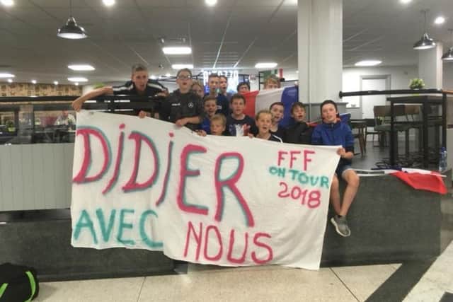 The young Dragons de la Vaucouleurs arrive at the airport to the news that France have won the World Cup.