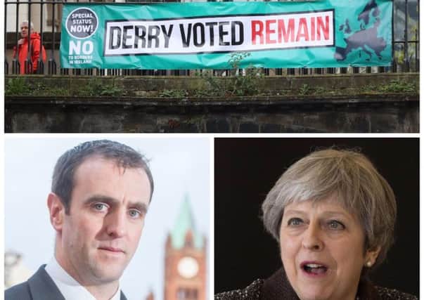 A poster erected during EU negotiator Michel Barnier's recent visit to Derry and below Mark H Durkan and Theresa May.
