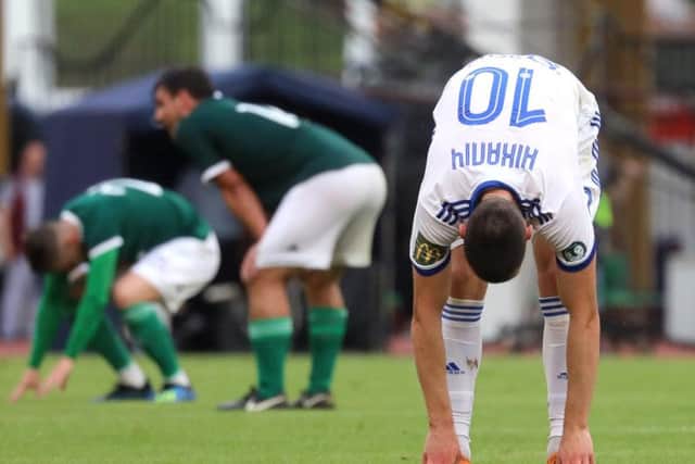 Dinamo Minsk midfielder, Uros Nikolic is exhausted at the final whistle as Derry City secure a 2-1 victory in Belarus.