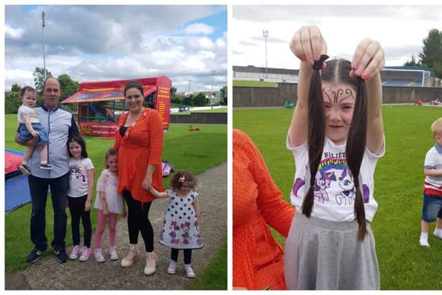 Cara pictured with her parents and sisters and (right) holding up the pigtails she will be donating.
