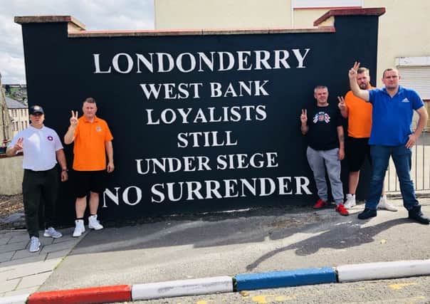 Paul Golding (second from left) with other representatives/ supporters of Britain First in Derry at the weekend.