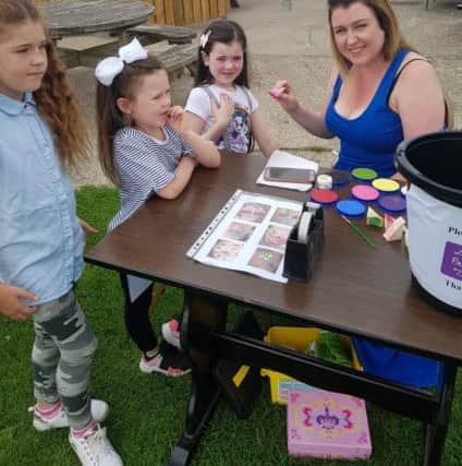 Cara with her aunt Roisin and some of the other children at the fundraising event.