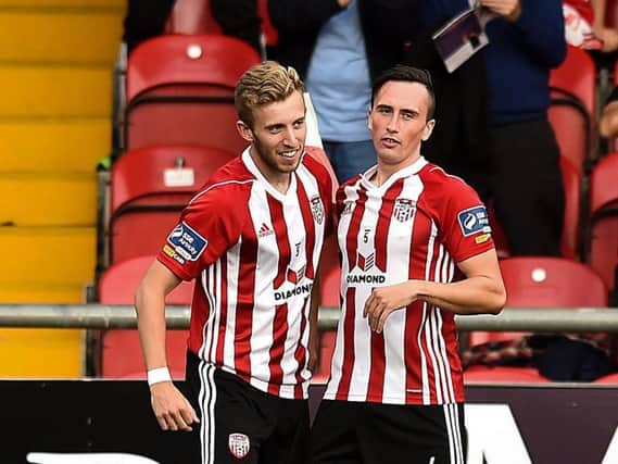 Derry City's Ally Roy celebrates with Aaron McEneff after scoring early on.