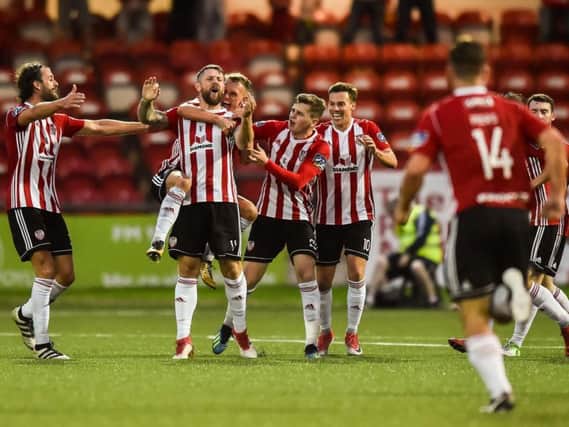 Derry City players celebrate with match winner Rory Patterson.