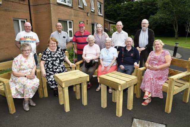 Members of the Bogside & Brandywell Health Forum's Derry Mens' Shed, back row, from left, Tony Kelly, Micky Kivlehan and John Carlin, pictured at the handover of garden furniture to the residents of Foyle Fold, Limavady Road. Included are, from left, seated, Peggy Quinn, Mary Doherty, Audrey Browne, Margaret Orr, Jack Miller and Jemina Caldwell, back row, Maureen Carlin, Co-ordinator, Billy Allen, Chairman of the Foyle Fold Tenants Association, and John Quinn. DER3018-141KM