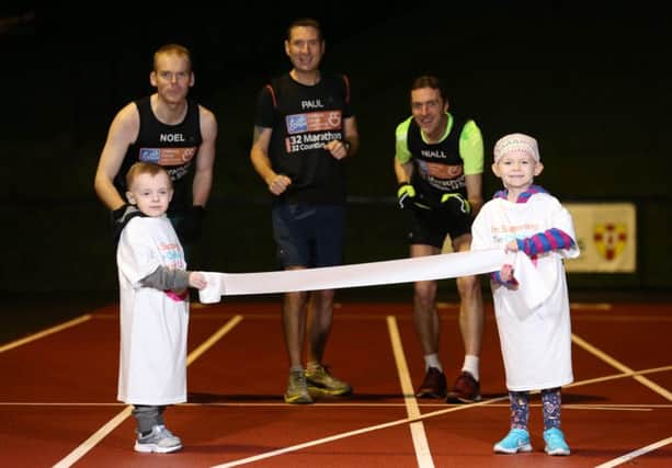 CCU32 runners Noel McNally, Paul Tyrell and Niall Farquharson prepare for the start of their CCU32 Challenge, along with the help of little Erin and Zach who are both receiving treatment at the Unit.