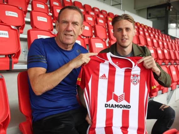 Derry City manager Kenny Shiels pictured alongside new signing Kevin McHattie.