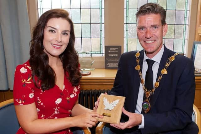 Mayor, Cllr John Boyle, presents a commemorative gift to soprano Margaret Keys at a civic reception held in the Guildhall to mark her achievements within the music industry. (Photo - Tom Heaney, nwpresspics)
