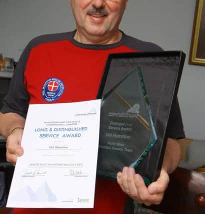 Uel Hamilton who received a Long & Distinguished Service certificate and award from the Northern Ireland Mountain and Cave rescue Coordinating committee in 2011 .  INLS 2911-503MT.