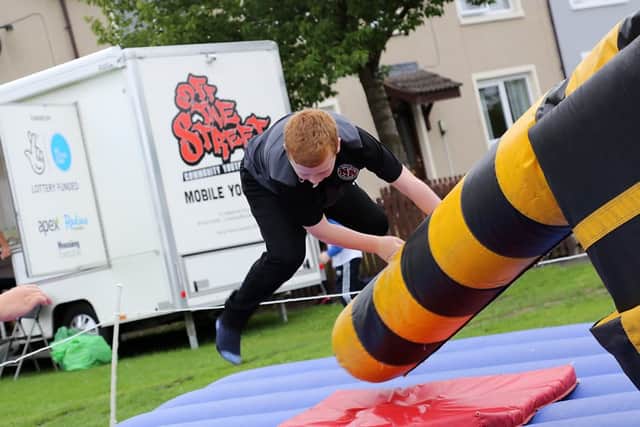 Young people battling it out on the Total Wipeout