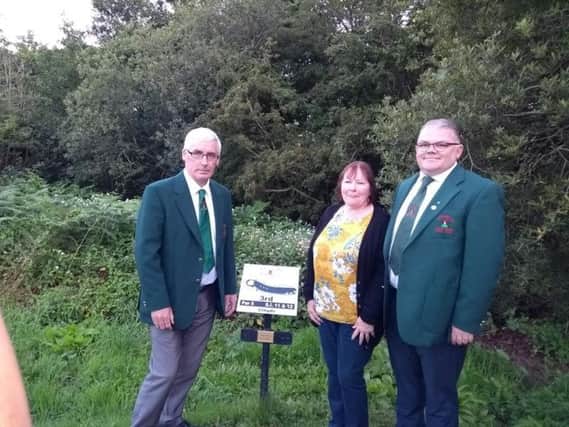 Redcastle Golf Club captain, Patrick Canning (right) and club member, Terry Green pictured with Sheena, the wife of the late Ben Casey, at the official renaming of the third tee-box.