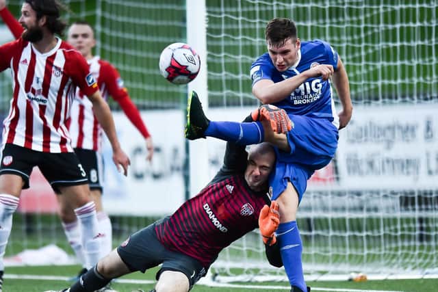 Kevin Toner of St Patrick's Athletic challenges Gerard Doherty of Derry City during the Irish Daily Mail FAI Cup Second Round match at Brandywell.