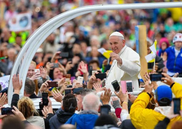 Pope Francis waves to crowds in Phoenix Park, Dublin. (Picture: Ronan McGrade/Pacemaker)