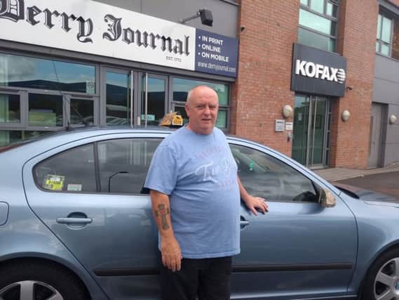 Taxi driver Martin Stewart whose car was damaged by a gang of youths on Saturday night