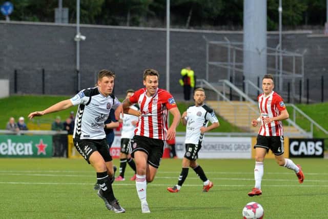 Ben Fisk under pressure from Dan Casey, Bohemians as Keith Ward looks on at the Brandywell  Stadium on Friday night last. DER3518GS025