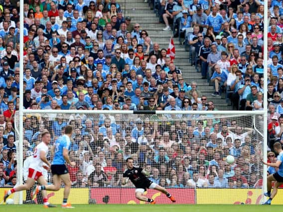 Dublin's Paul Mannion scores his side's crucial first half penalty past goalkeeper Niall Morgan.