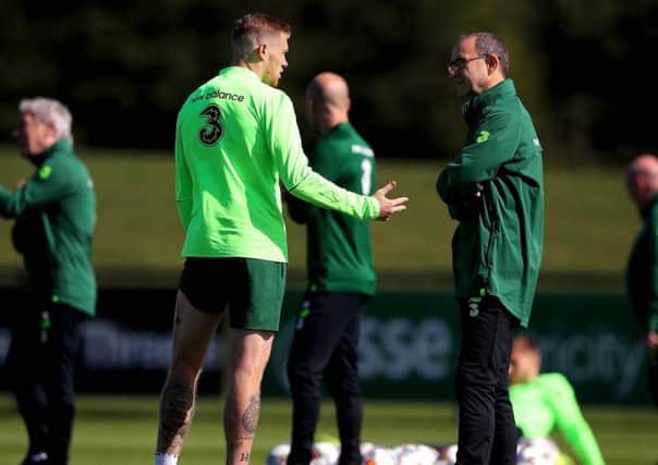 James McClean with manager Martin O'Neill at the FAI National Training Centre on Monday.