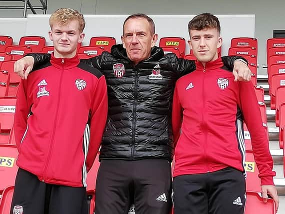 Derry City manager Kenny Shiels welcomes pair Aidy Delap (left) and Shane McNamee, after the pair signed three year deals with the club.