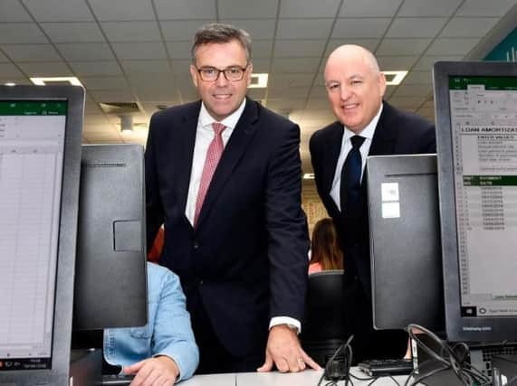 Pictured at the announcement by Alchemy Technology Services in the North West Regional College were Alastair Hamilton, left, CEO, Invest NI, John Harkin, Director and Founder of Alchemy. DER3718-161KM