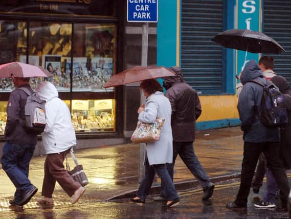 People running in the rain