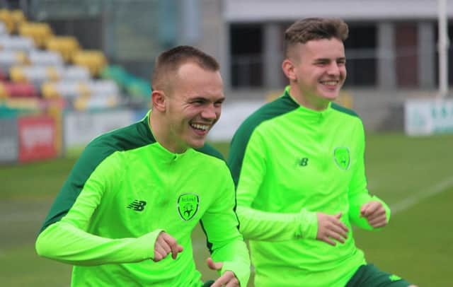 Brothers Rory and Ronan Hale enjoy a laugh during the warm-up ahead of the Euro 19 Championships qualifier against Germany in Dublin.