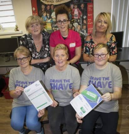 BRAVE THE SHAVE. . . .Three brave ladies. Ann Wilson, Vivienne Hockley and Donna Smith who will come under the scissors shortly in aid of MacMillan Cancer Support. The ladies are pictured with Marie Gillespie, Chair, Galliagh Womenâ¬"s Group, Michelle McLaren, Pink Ladies and Rosie Doherty, Co-Ordinator, Galliagh Womenâ¬"s Group. (Photo: Jim McCafferty Photography)
