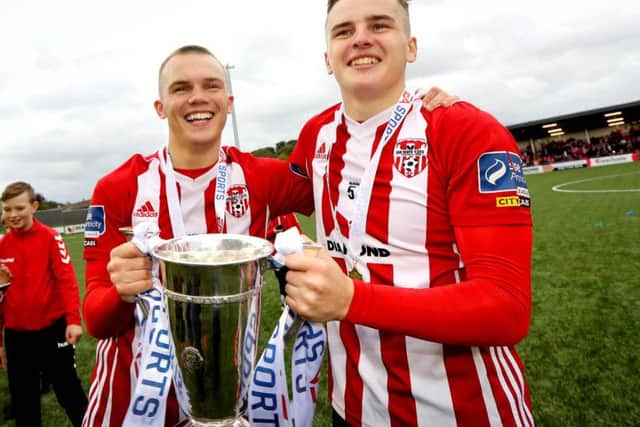 Derry's Rory Hale and Ronan Hale celebrate with the trophy