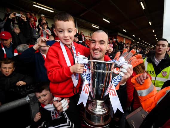 Gerard Doherty with his son Cian celebrate their EA Sports Cup success.