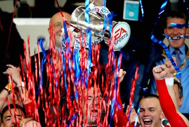 Gerard Doherty lifts the trophy 
with the help of Nicky Low and Rory Hale.  Â©INPHO/Ryan Byrne