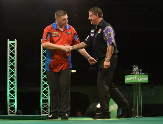 Gurney shakes the hand of Gary Anderson after he started the tournament with a 10-8 win over the Scotsman in Brighton.