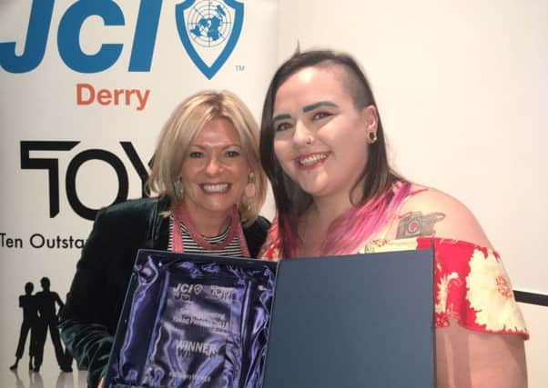 North West Regional College lecturer Ann Tracey congratulates Aine McFadden after she was named as an oustanding young person by JCI.