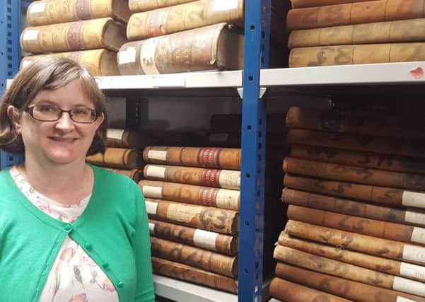 Donegal County Archivist Niamh Brennan, with some of the rich collection of records held by the Archive Service of Donegal County Council.