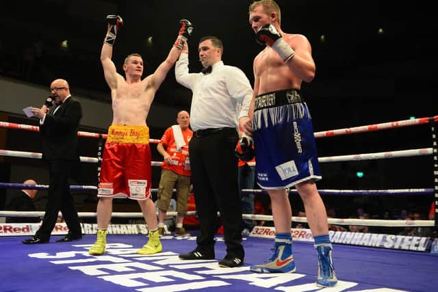 Sean McGlinchey has his hand raised after victory over Dan Blackwell at the Waterfront on his last outing as a professional in June 2017.
