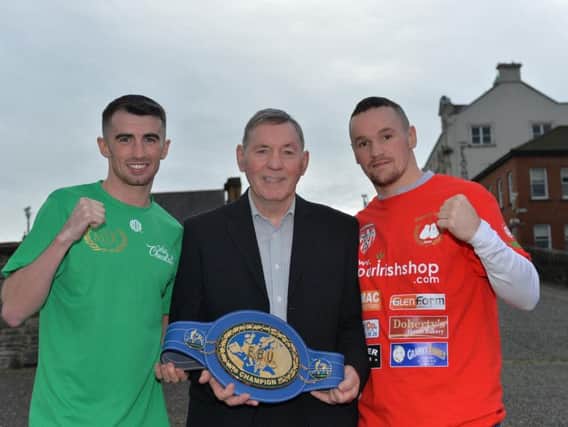 Derry boxers Tyrone McCullagh and Sean McGlinchey pictured with Charlie Nash and his EBU belt after the Danger at the Docks press conference held at the Bentley Bar on Tuesday afternoon. DER4018GS010
