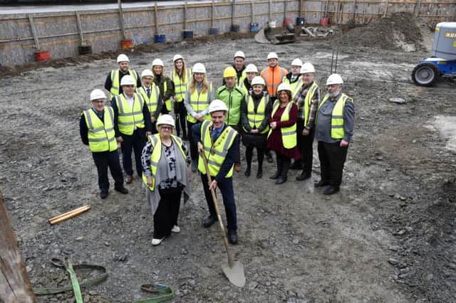 The Mayor, Councillor John Boyle cutting the first sod on the site of the new North West Learning Disability Centre at Foyle Road on Tuesday. Included is Adele Darby, Chairperson of Destined, a representatives of various organisations invloved with the project. DER4118-181KM