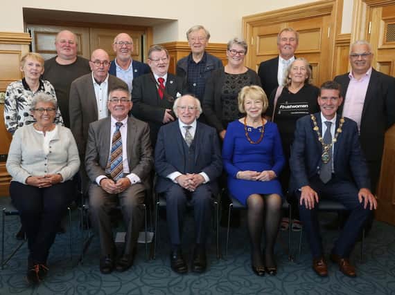 The President Michael D. Higgins and his wife Sabina with the Mayor John Boyle, civil rights veterans and members of the  N. Ireland Civil Rights Commemoration Committee.