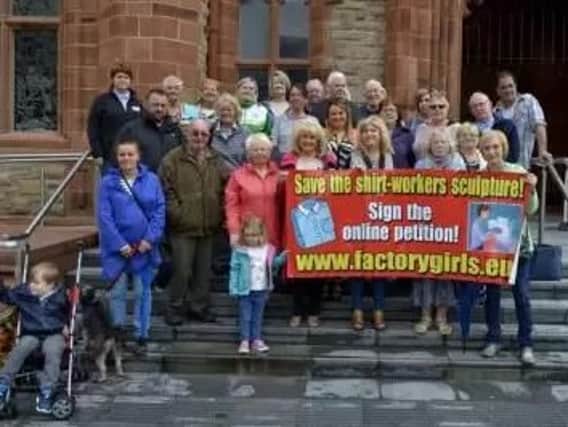Supporters of a 'factory girls' sculpture pictured outside the Guildhall in 2016.