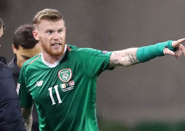 Republic of Ireland's James McClean (right) and assistant manager Roy Keane.