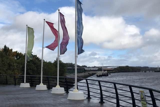 Flags near Sainsbury's in Derry during Storm Ali.