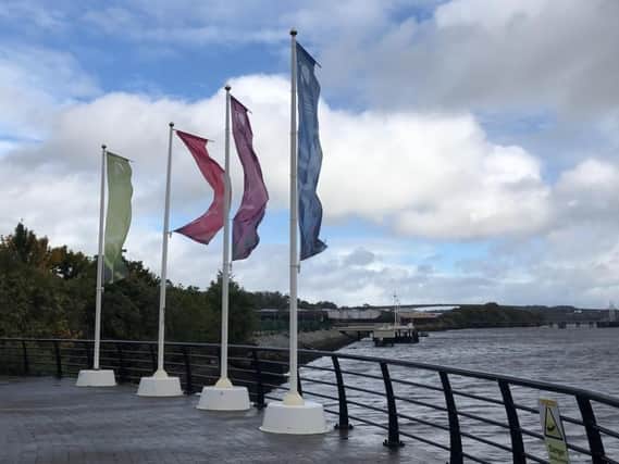 Flags near Sainsbury's in Derry during Storm Ali.