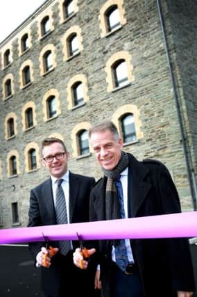 Paul Price, Department for Communities, joins Michael McDonnell, Choice Housing, open the new Strand Rd. scheme.