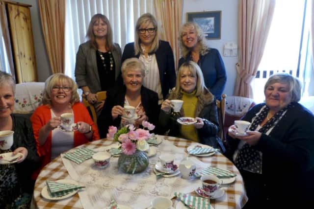 Past and present staff of William Street Residential Home having afternoon tea to mark the opening of Rosies Room