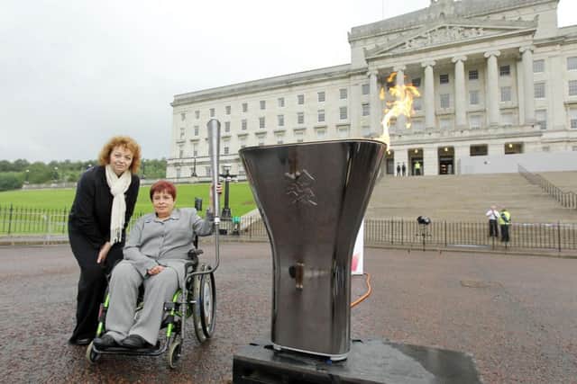 Press Eye - Belfast - Northern Ireland -  Saturday 25th August  2012 - 
 
Paralympic Flame celebrations in Northern Ireland.

Sports Minister Caral N Chuiln pictured at Parliament Buildings, Stormont where a cauldron was lit as part of a day of celebrations around the Paralympic Flame.
From this Cauldron, splinters of the Flame were taken to local council areas by Flame Ambassadors. 

Sports Minister Caral N Chuiln is pictured with Angela Hendra who lit the Cauldron